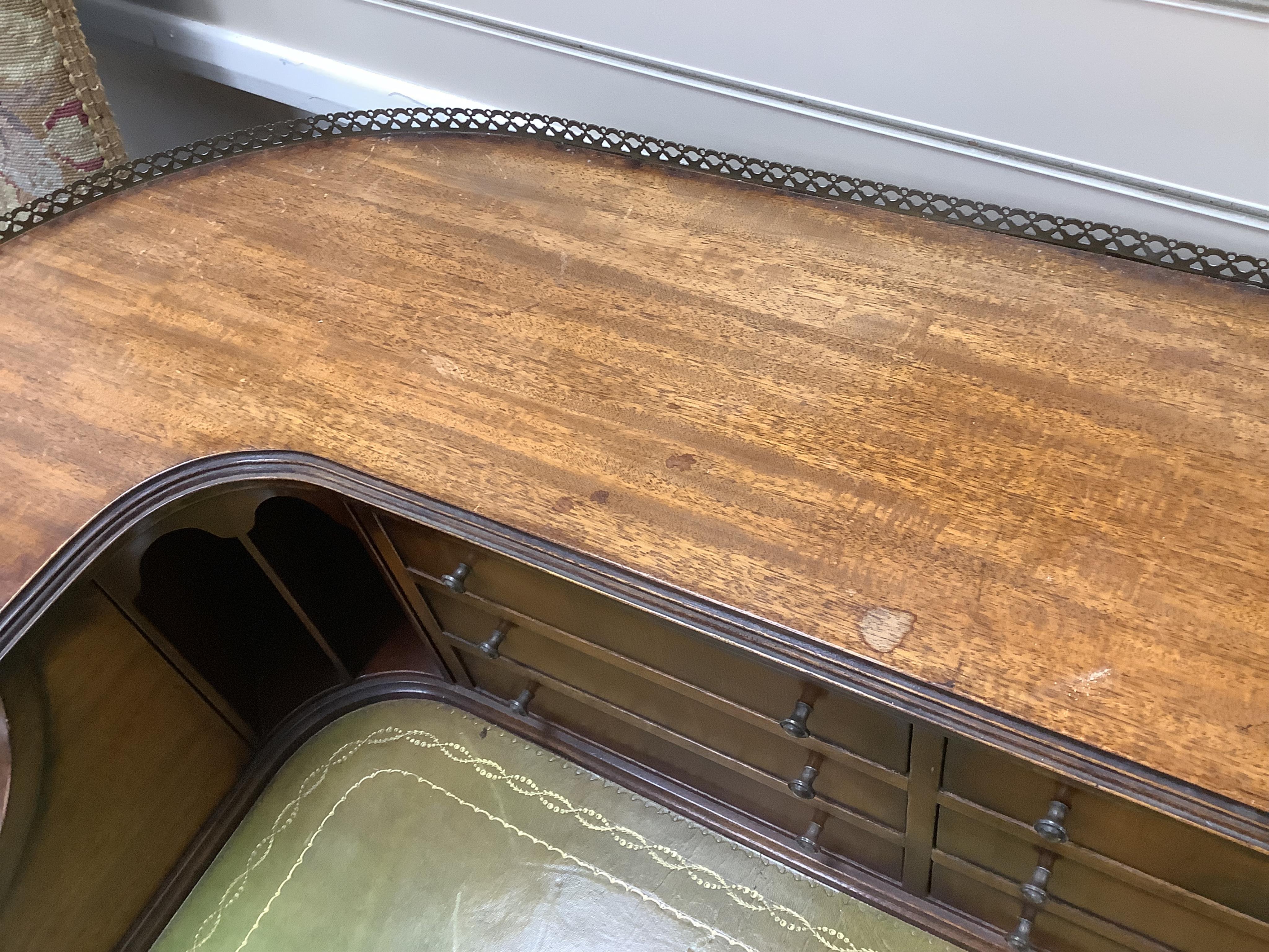 A reproduction mahogany Carlton House style desk, width 122cm, depth 62cm, height 98cm. Condition - fair to good